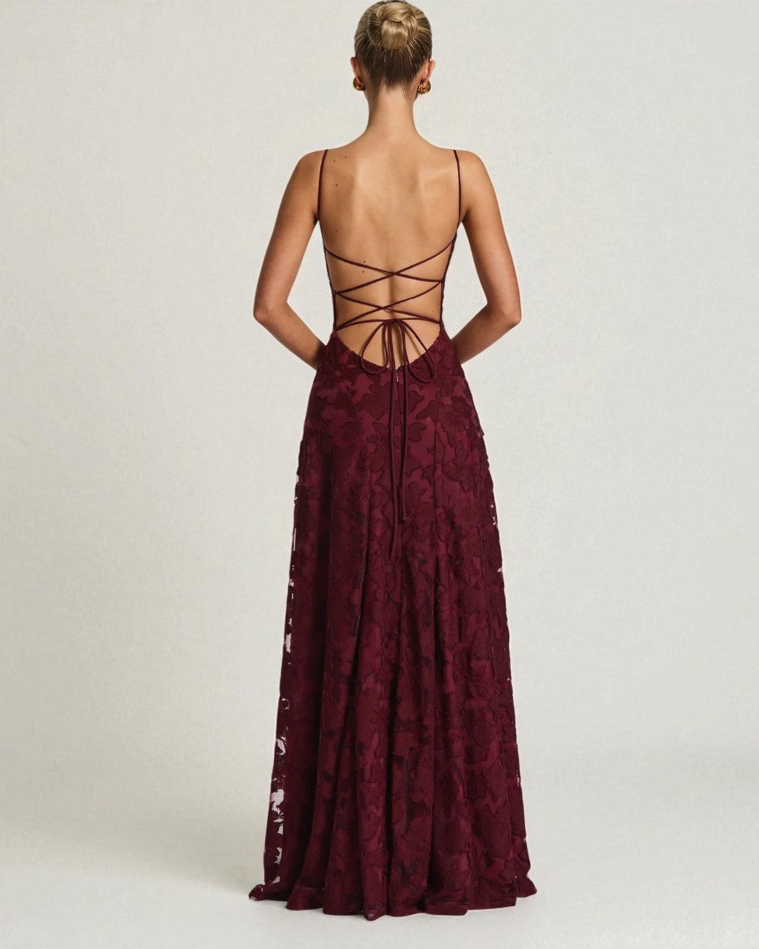 Back view of cherry red lace bridesmaid gown with elegant fit