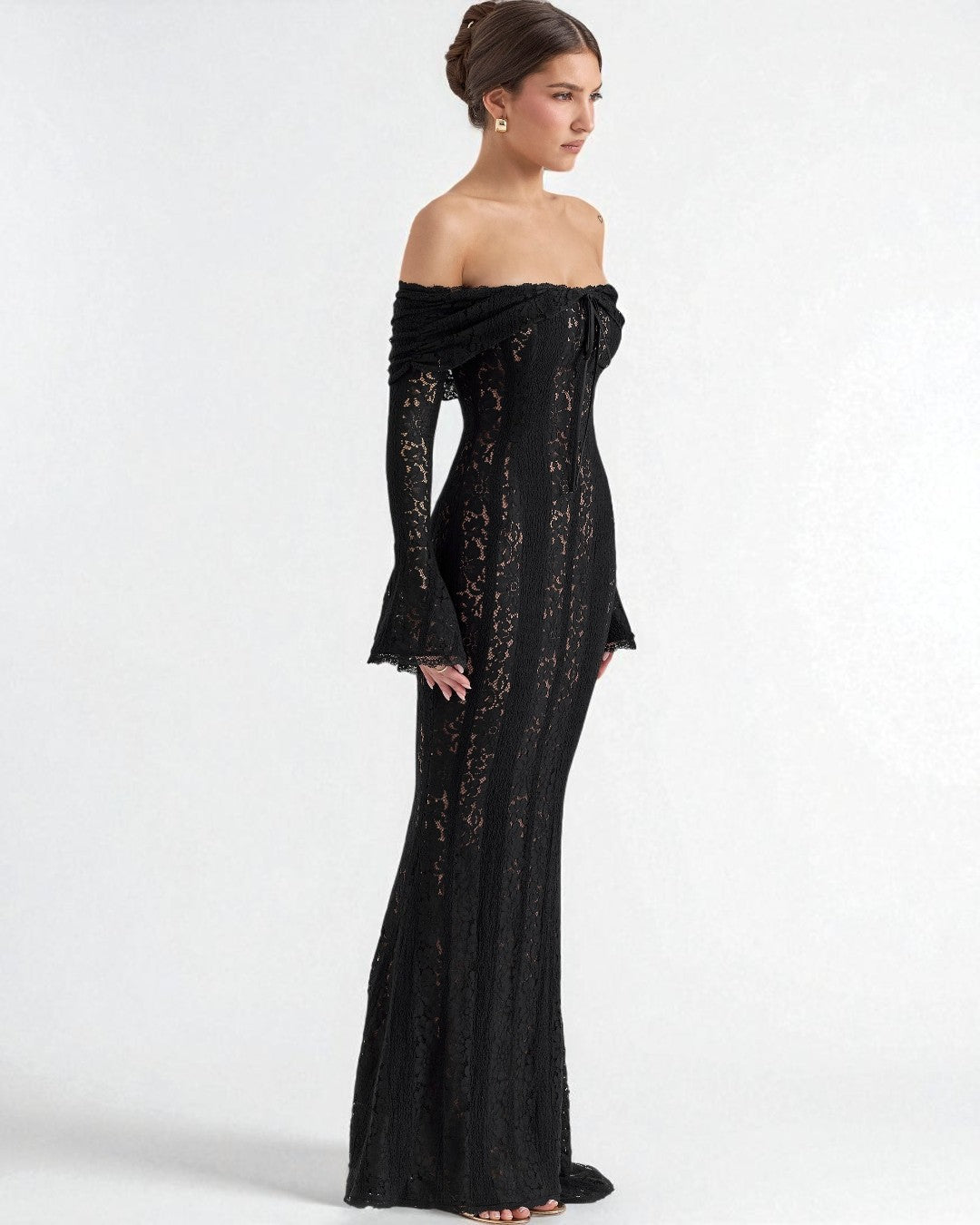 Black off-shoulder maxi prom dress styled with heels for graduation night