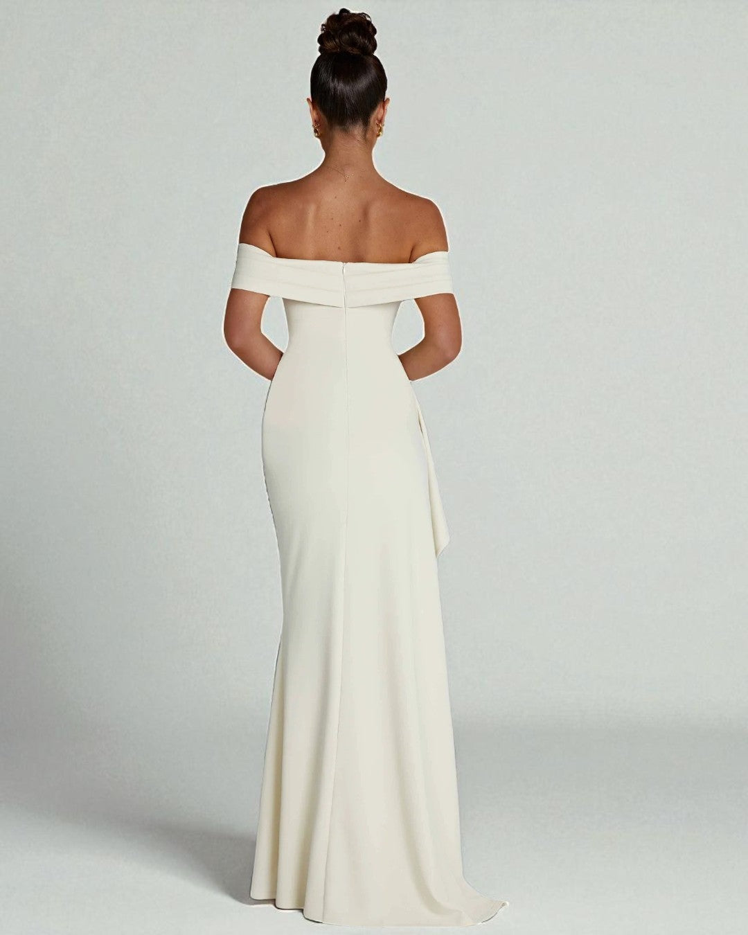 Back view of ivory off-shoulder prom gown with elegant design