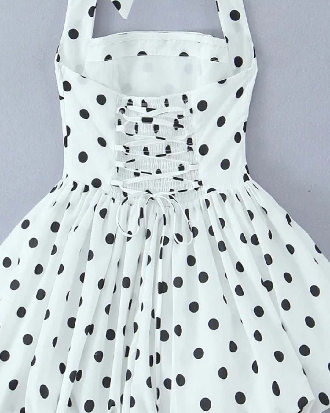 Close-up of polka dot fabric on Eloise mini women’s dress